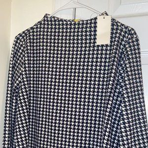 hounds tooth mockneck top with neon yellow zipper